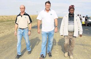 END OF ROAD: Concerned community members Gerald Goosen, Sherwin Carr and Lucky Sitwayi walk on an abandoned tar road project on the Wild Coast